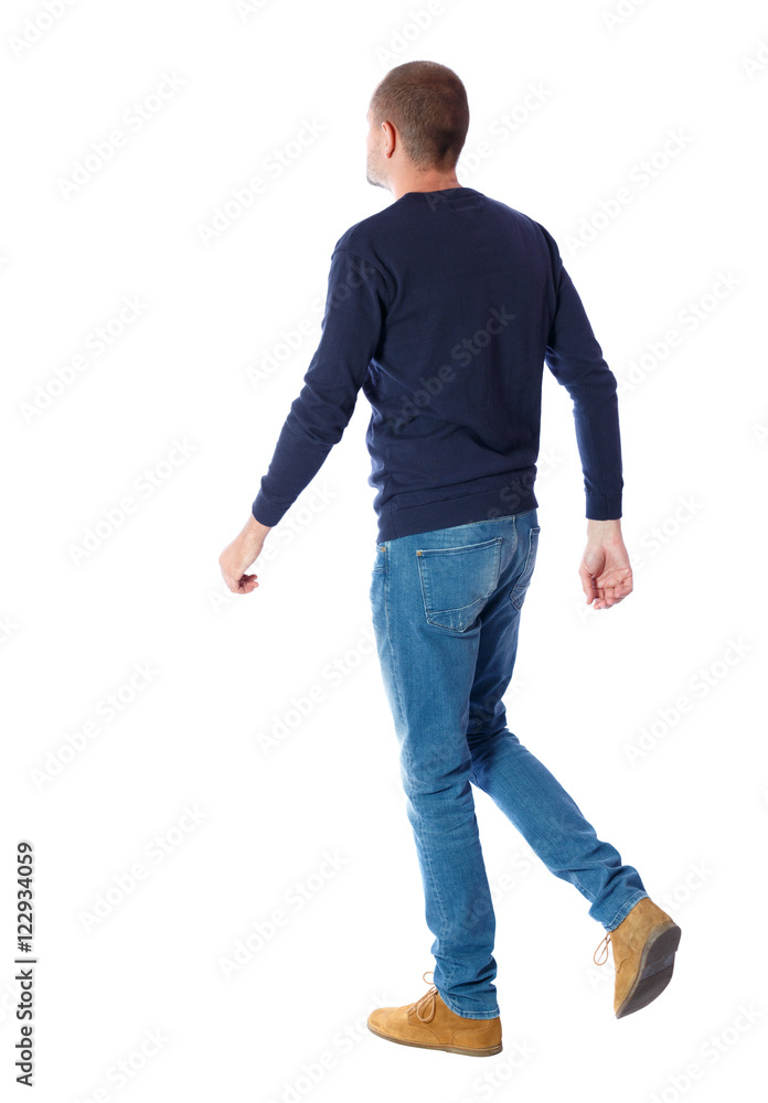 Back view of going handsome man. walking young guy . Rear view people  collection. backside view of person. Isolated over white background. A guy  in a black sweater passes. Stock Photo