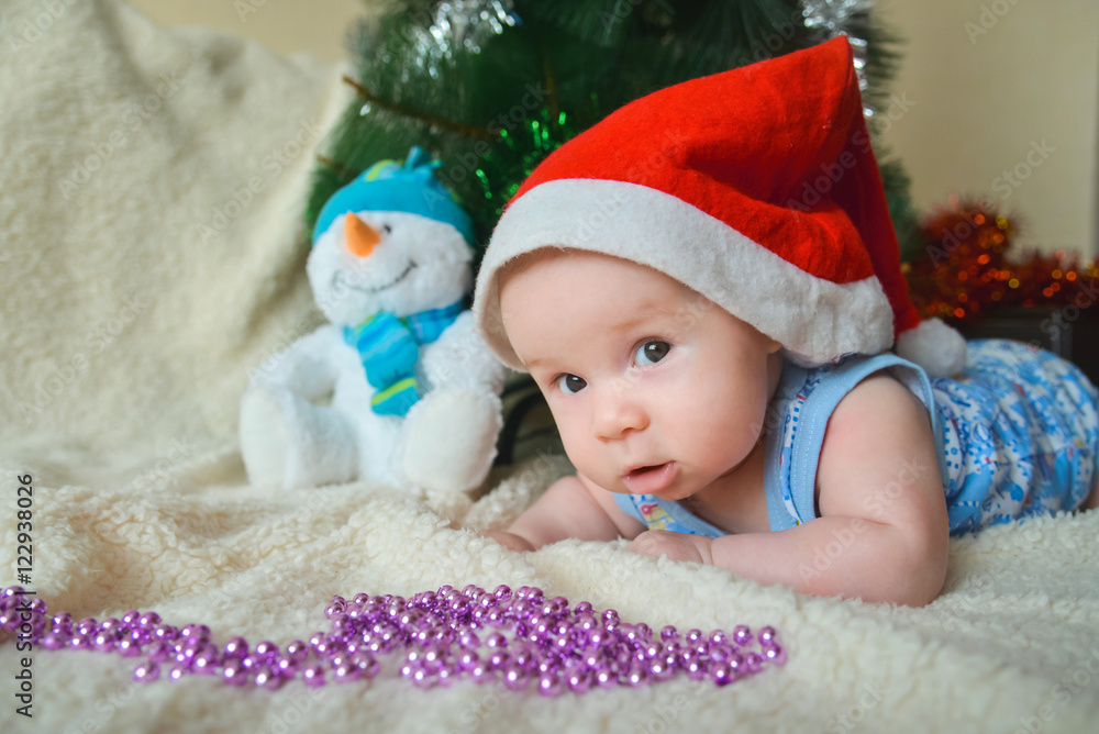 Christmas card with cute baby boy weared in santa red hat Christmas card with cute baby boy weared in santa red hat