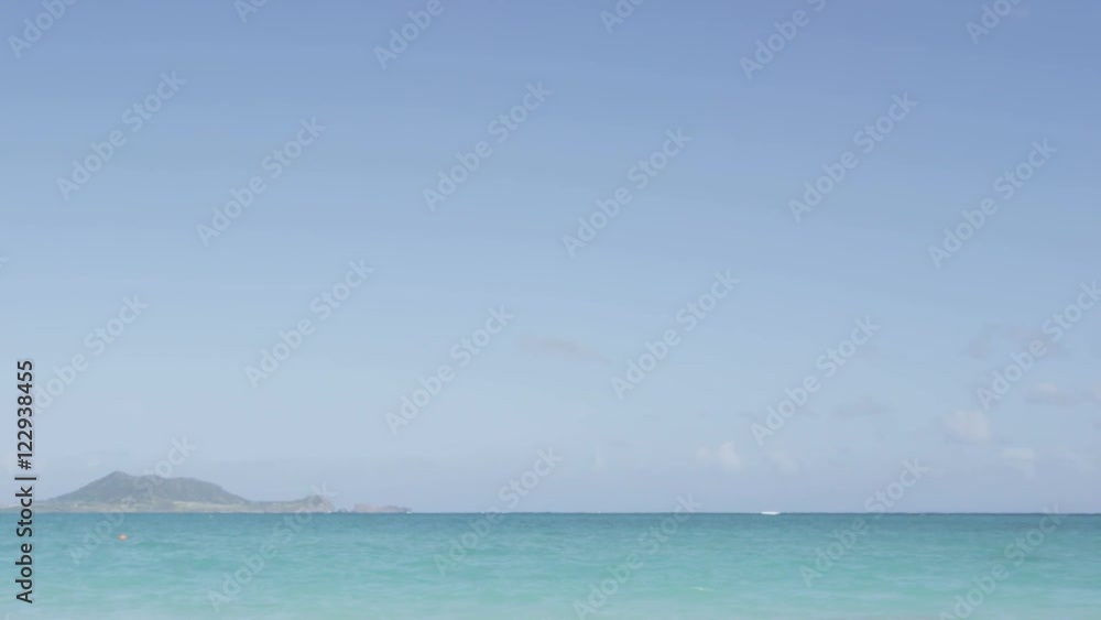 Couple on vacation relaxing on beach under blue sky during travel holidays. Happy woman and man in love on honeymoon lying in sand on beautiful paradise beach sun tanning having fun. Couple on vacation relaxing on beach under blue sky during travel holidays. Happy woman and man in love on honeymoon lying in sand on beautiful paradise beach sun tanning having fun.