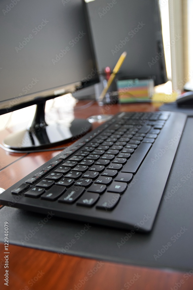 Office desk with computer and other items in the day Office desk with computer and other items in the day