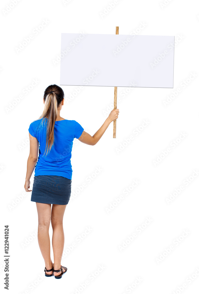 Back view woman showing sign board. man holds information plate. Rear view people collection. backside view of person. Isolated over white background.
Girl in a blue shirt holding a poster. Back view woman showing sign board. man holds information plate. Rear view people collection. backside view of person. Isolated over white background.
Girl in a blue shirt holding a poster.