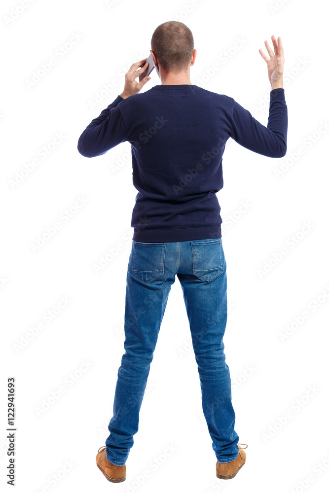 Back view of pointing young men talking on cell phone. Young guy gesture. Rear view people collection. backside view of person. Isolated over white background. A guy in a black sweater a hand Back view of pointing young men talking on cell phone. Young guy gesture. Rear view people collection. backside view of person. Isolated over white background. A guy in a black sweater a hand