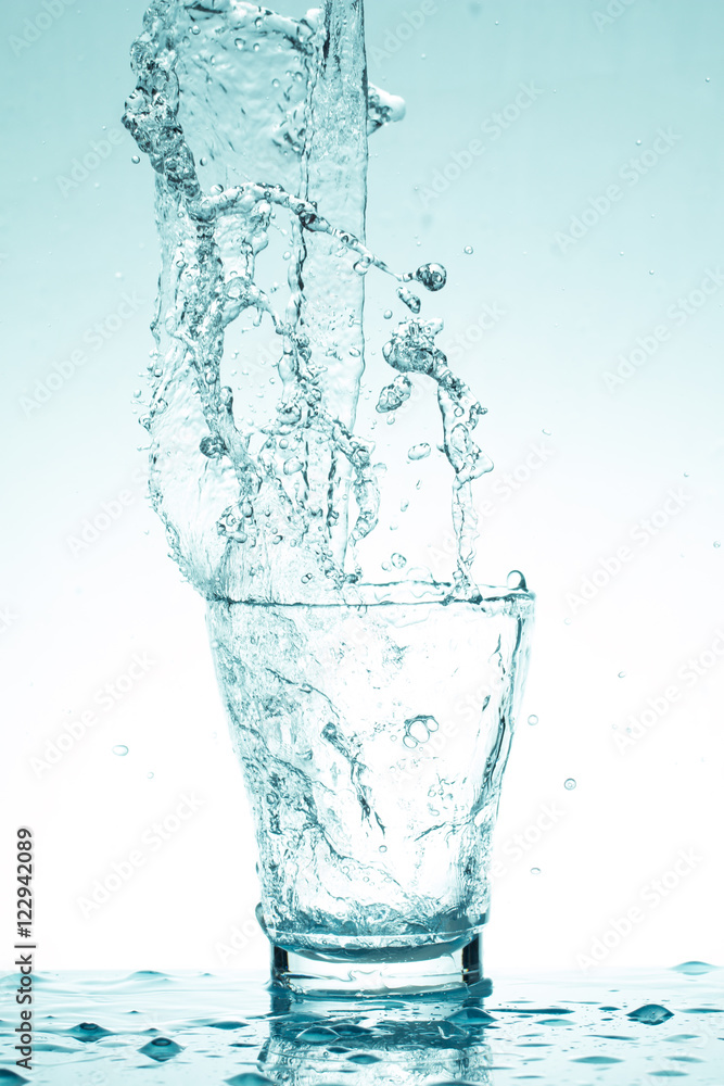 water splash in glasses isolated on white water splash in glasses isolated on white