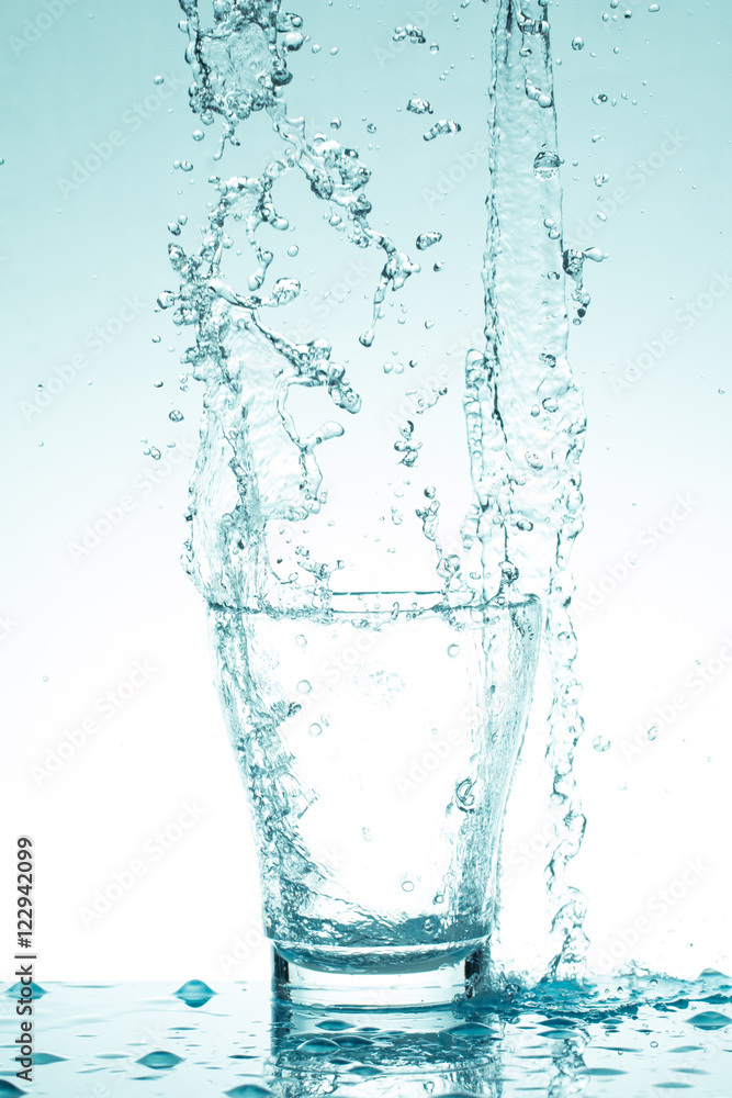 water splash in glasses isolated on white water splash in glasses isolated on white