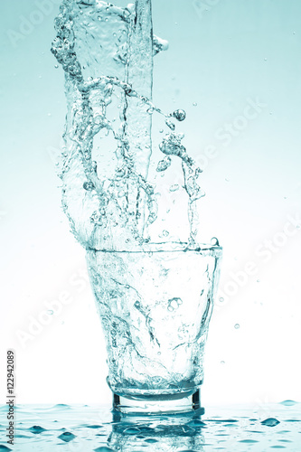 water splash in glasses isolated on white