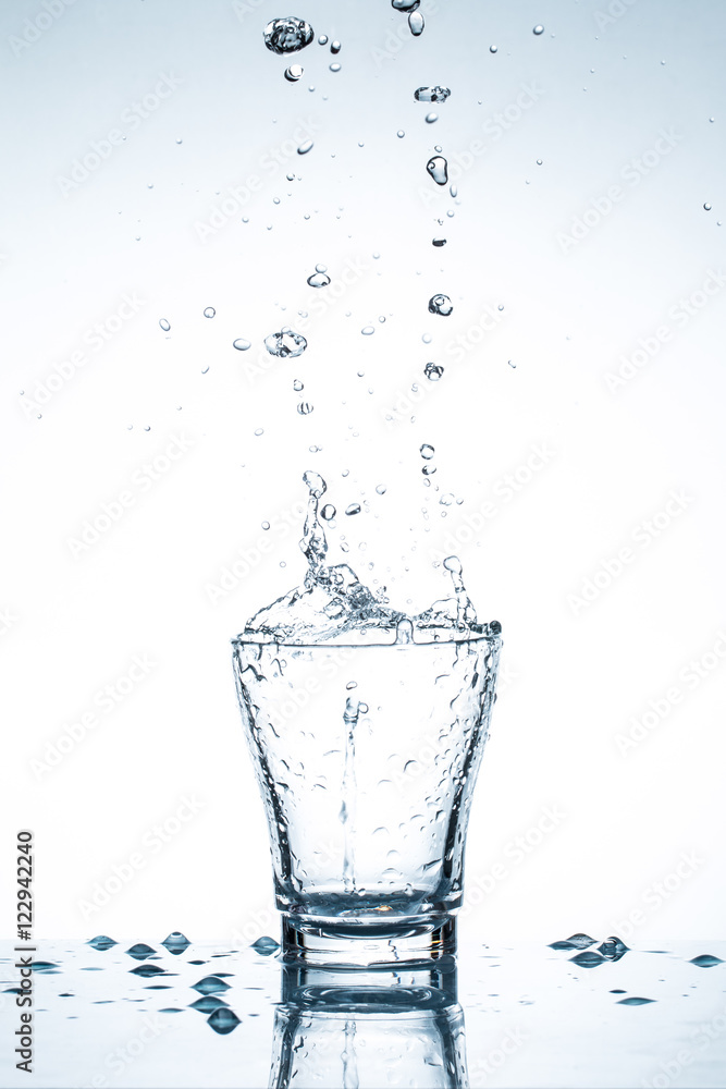 water splash in glasses isolated on white