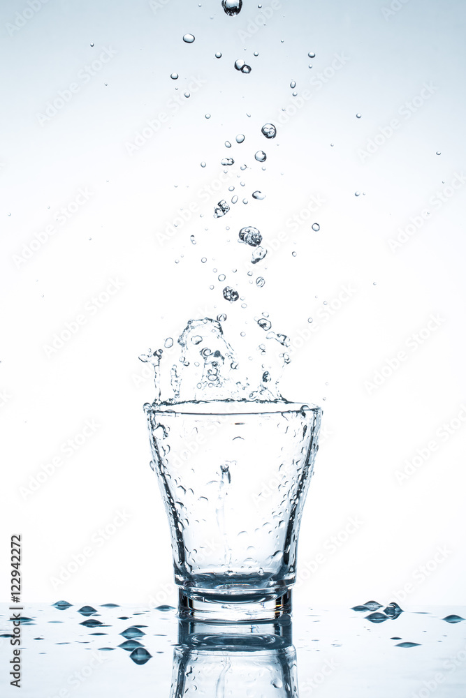 water splash in glasses isolated on white water splash in glasses isolated on white