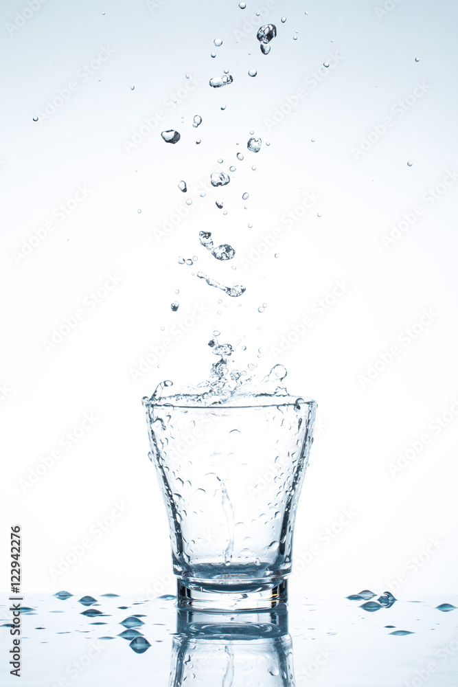 water splash in glasses isolated on white water splash in glasses isolated on white