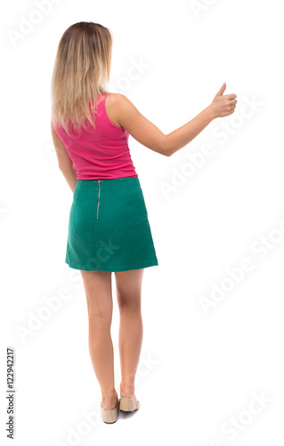 Back view of  woman thumbs up. Rear view people collection. backside view of person. Isolated over white background.  © ghoststone