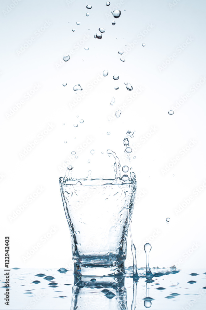water splash in glasses isolated on white water splash in glasses isolated on white