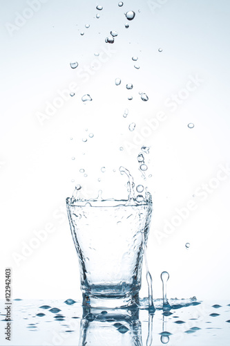 water splash in glasses isolated on white