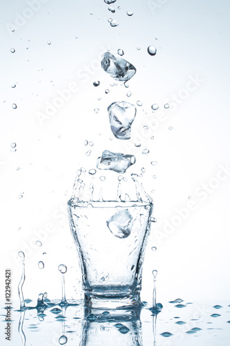 water splash in glasses isolated on white