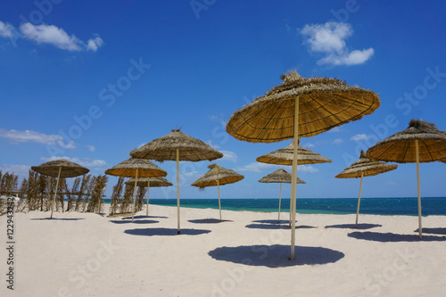 beach with umbrellas © anji77702