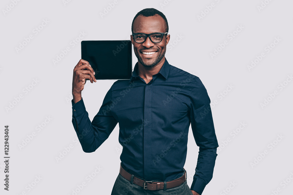 Copy space on his tablet. Copy space on his tablet.