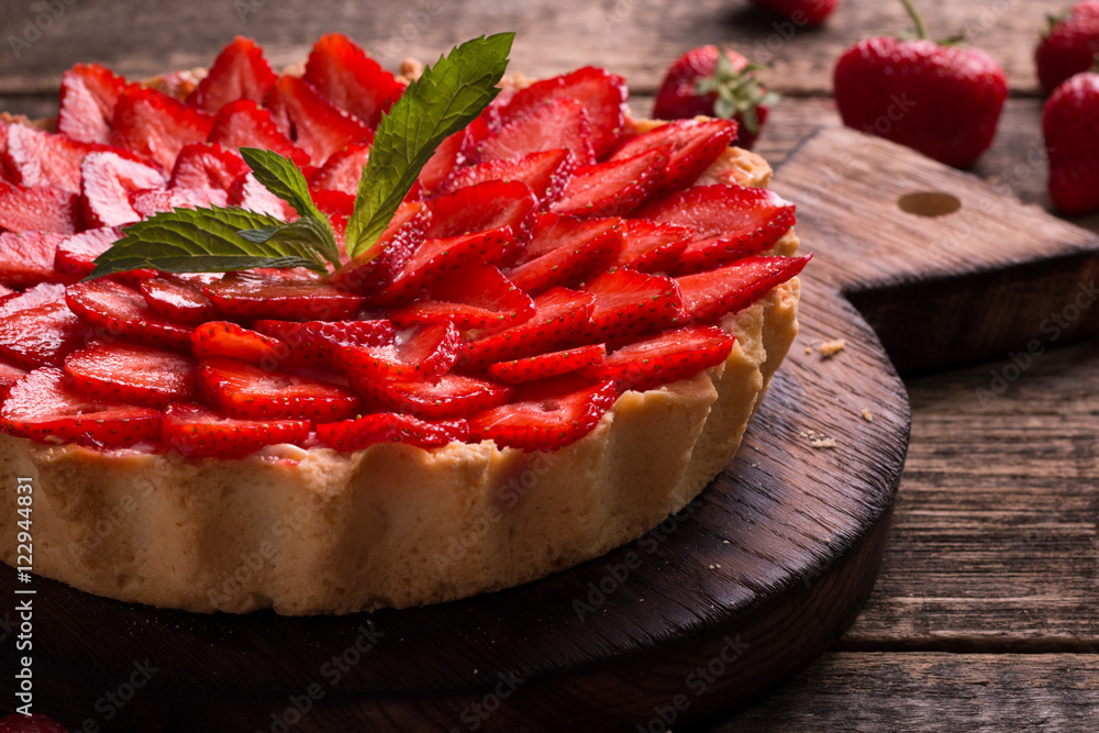 Tart with strawberries and whipped cream on wooden vintage table Tart with strawberries and whipped cream on wooden vintage table