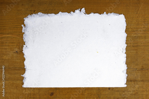 white handmade paper on wooden background