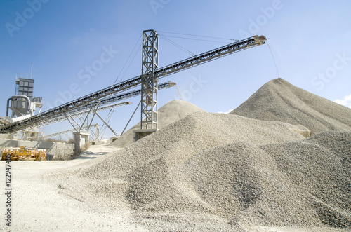 Working belt conveyors and a piles of rubble in Gravel Quarry