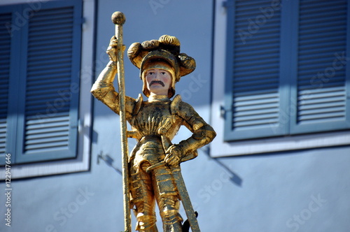 Freiburg im Breisgau - Vergoldete St. Georgs-Statue auf dem Münsterplatz photo