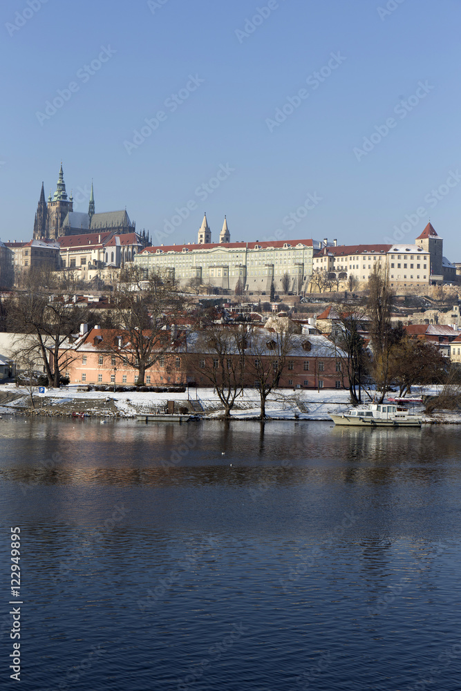 Snowy Prague gothic Castle above river Vltava in the sunny Day,  Czech Republic