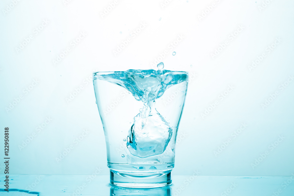 water splash in glasses isolated on white water splash in glasses isolated on white