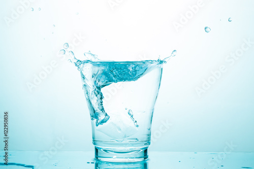 water splash in glasses isolated on white