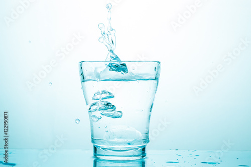 water splash in glasses isolated on white