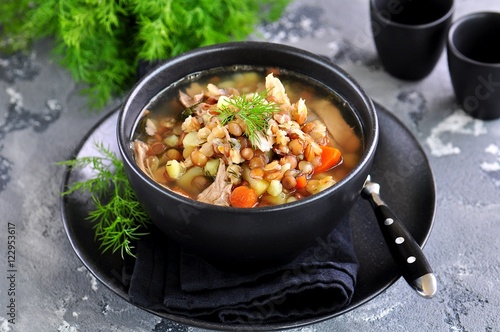 Lentil soup with chicken meat, potatoes, carrots and dill.