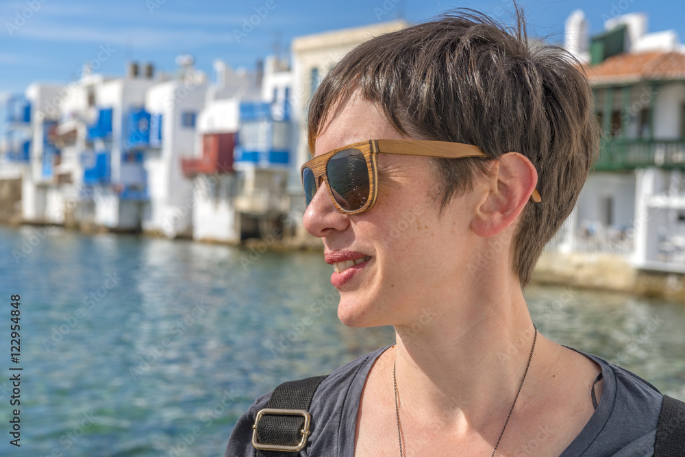 Young beautiful woman in little Venice, Mykonos, Cyclades, Greec Young beautiful woman in little Venice, Mykonos, Cyclades, Greec