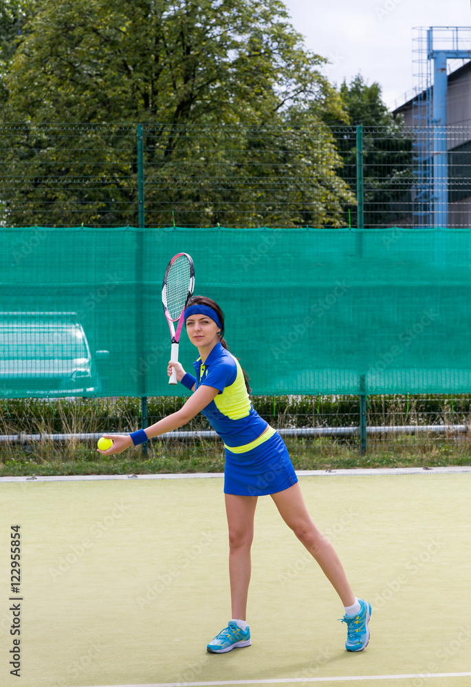 Young attractive female tennis player during a game
