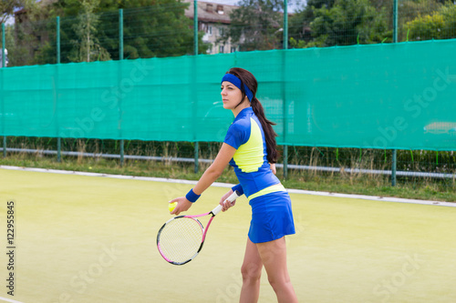 Successful sportswoman playing tennis