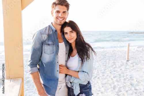Beautiful young couple embracing on the beach