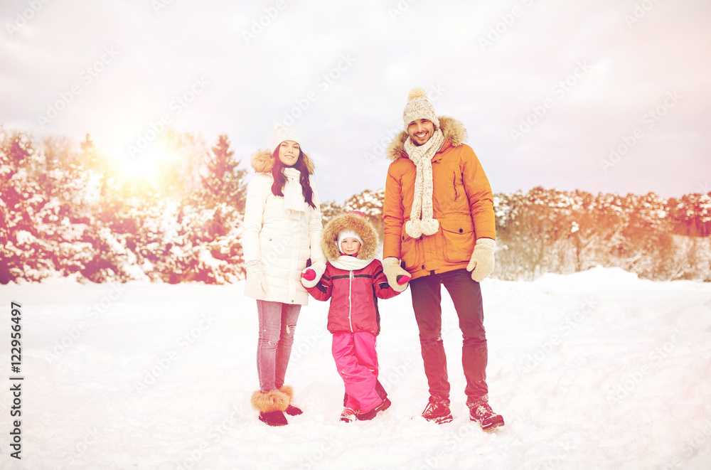 happy family with child in winter clothes outdoors happy family with child in winter clothes outdoors