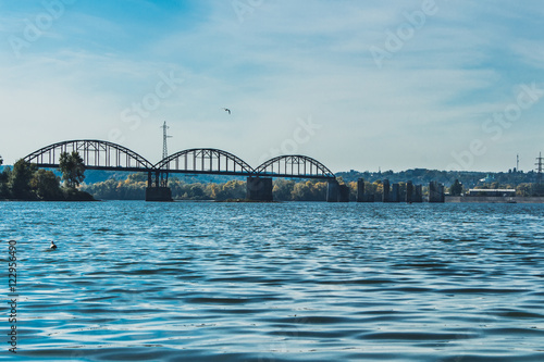 Destroyed iron bridge at the time of the Second World War against the blue sky. Kan?v. Ukraine.