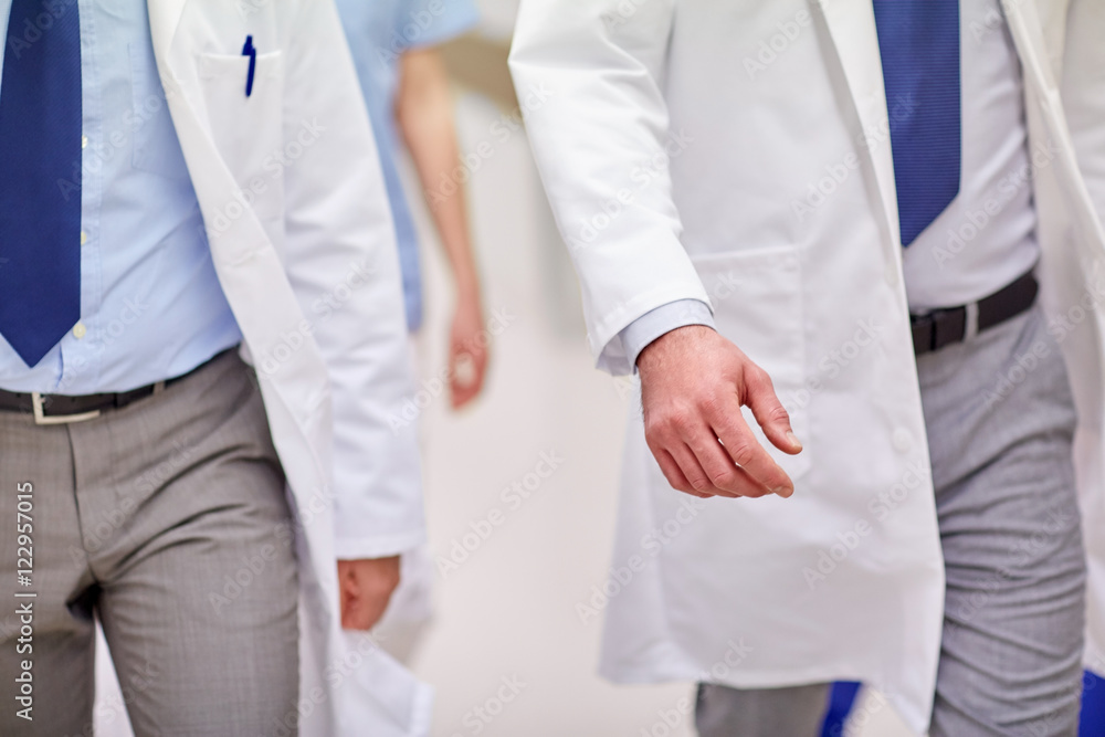 close up of medics or doctors walking in hospital close up of medics or doctors walking in hospital