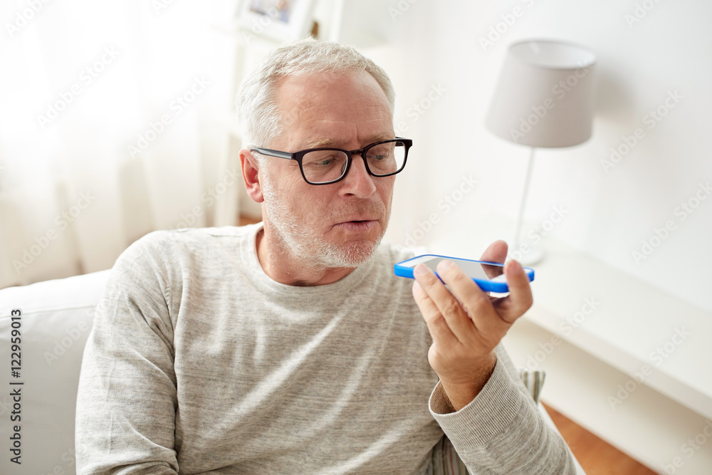 old man using voice command recorder on smartphone old man using voice command recorder on smartphone