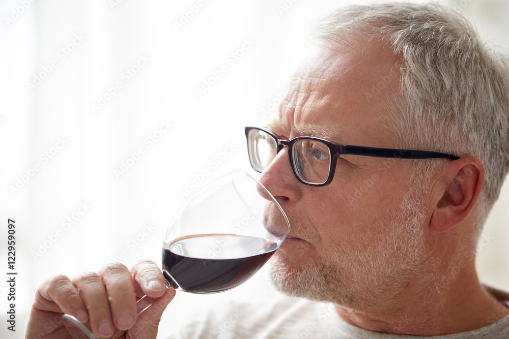 close up of senior man drinking wine from glass close up of senior man drinking wine from glass