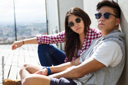 Happy young couple looking at the views in the city.