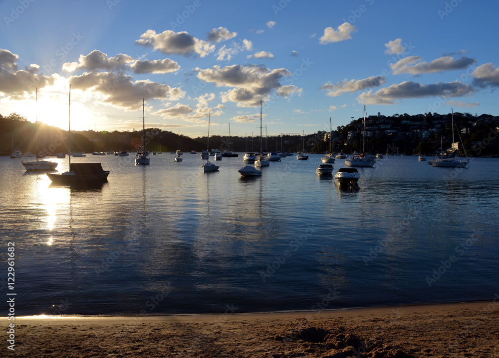 Fototapeta premium Yachts parking in the harbour in sunset
