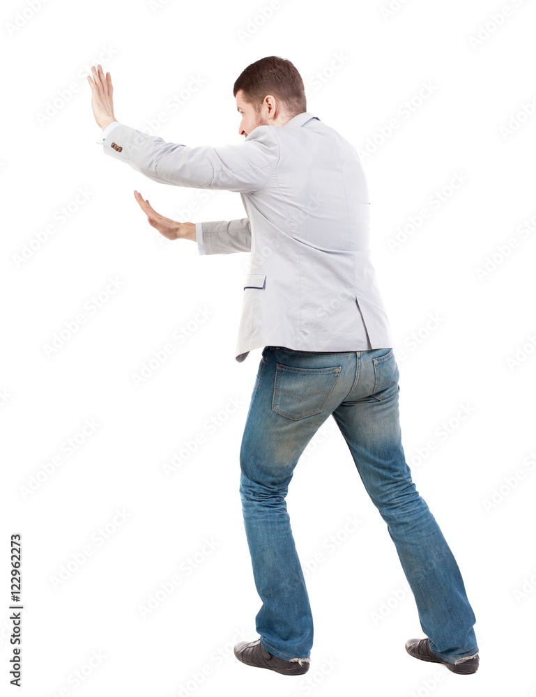 back view of business man pushes wall. Isolated over white background. Rear view people collection. backside view of person. Bearded man ran into an obstacle. back view of business man pushes wall. Isolated over white background. Rear view people collection. backside view of person. Bearded man ran into an obstacle.