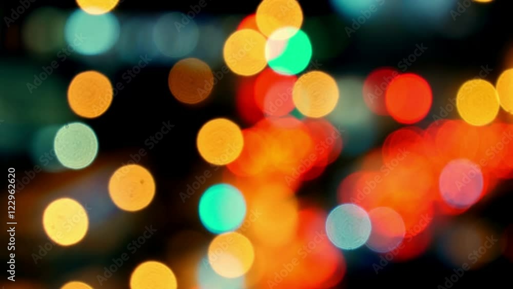 Pan across city blur background. Moving bokeh circles of night traffic.
Pan across city blur background. Moving bokeh circles of night traffic.