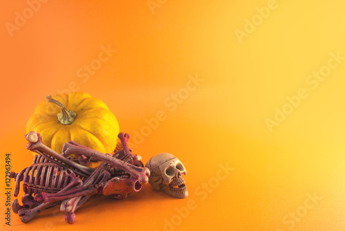 yellow pumpkin and skeleton skull bone dead © issaronow