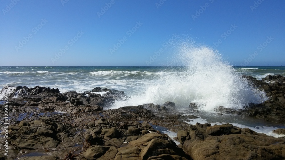 Ocean surf splashing rocks