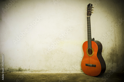 Guitar on background of a wall © GieZetStudio