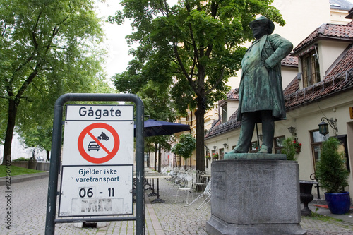 Photography Traffic sign and statue in downtown Oslo, Norway