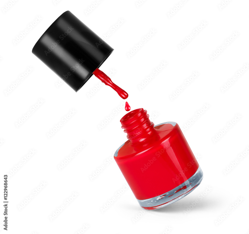 Fototapeta premium red nail polish bottle with splash isolated on white