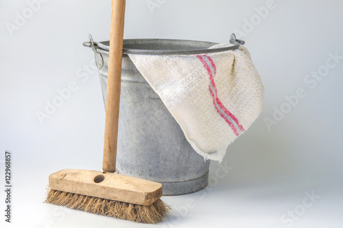 Old fashioned housekeeping with zinc bucket photo