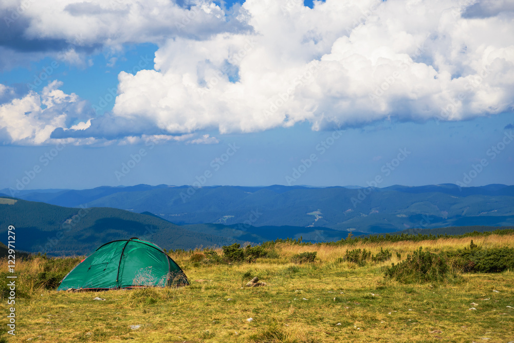landscape in the mountains with a tent