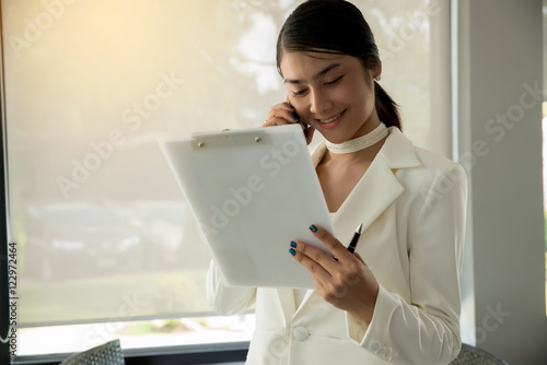Businesswoman talking on phone,happy and smile face,negotiating business