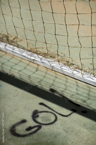 The Spanish word "gol!" (goal!) painted on the ground by a football goal, Seville, Spain