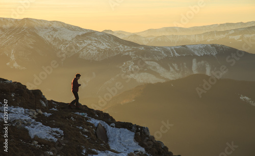 Silhouette in sunset in mountains © alpinetrail